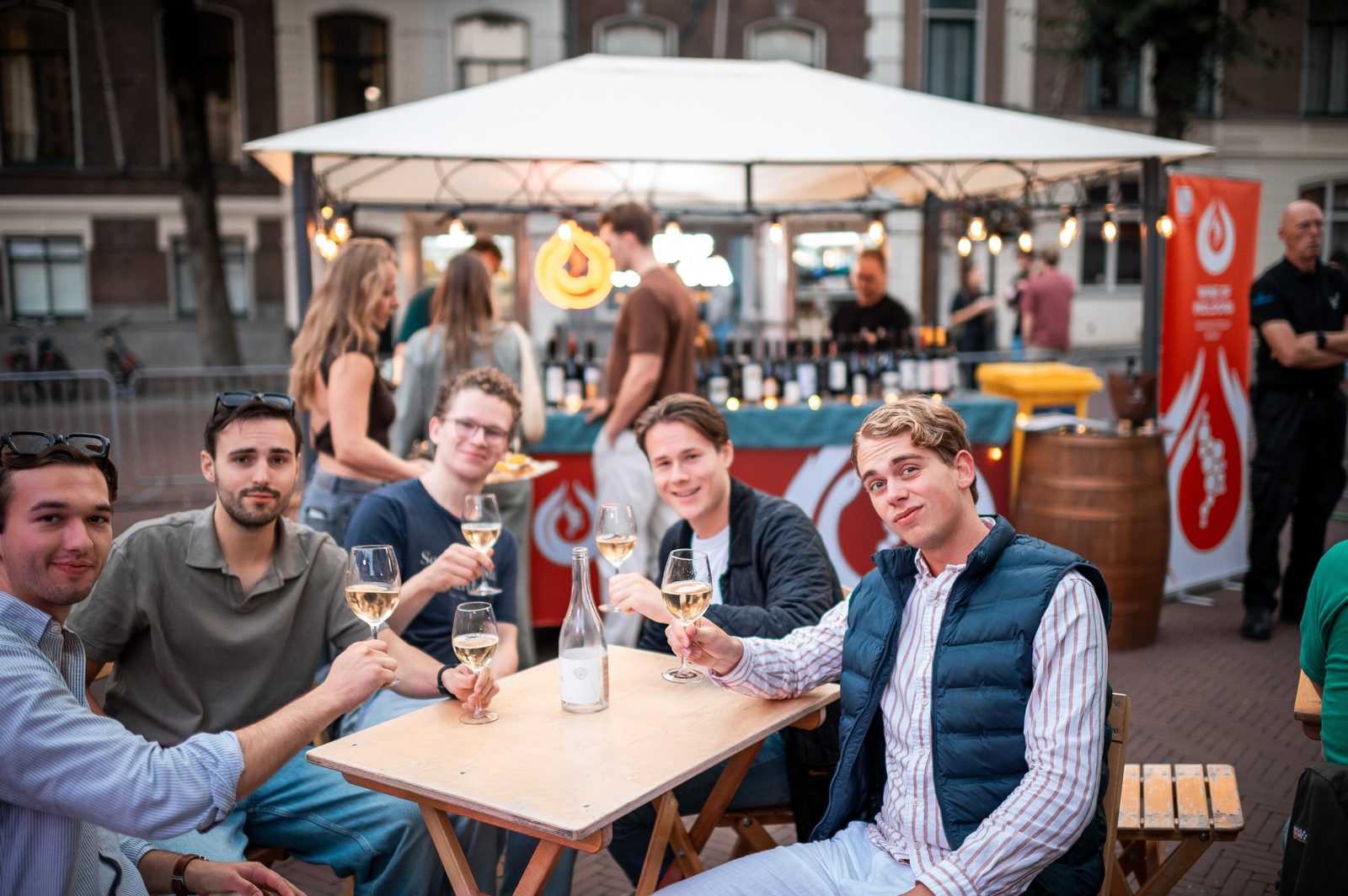 A group of guests seated outside at a community event.